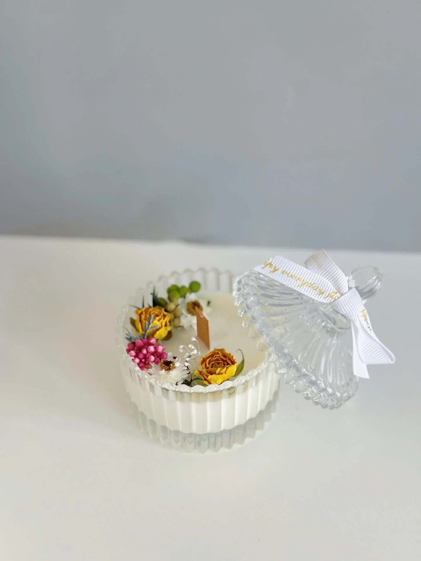 Floral White Candle in Clear Glass Jar - Image 4
