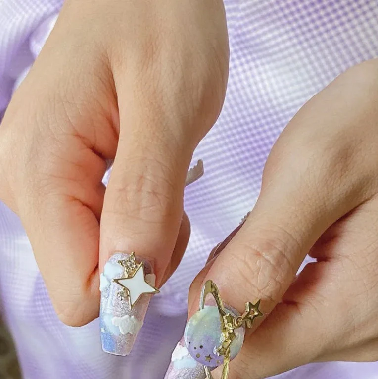 Hand Wearing Nail Art Sticker Pass Astronaut - Image 4