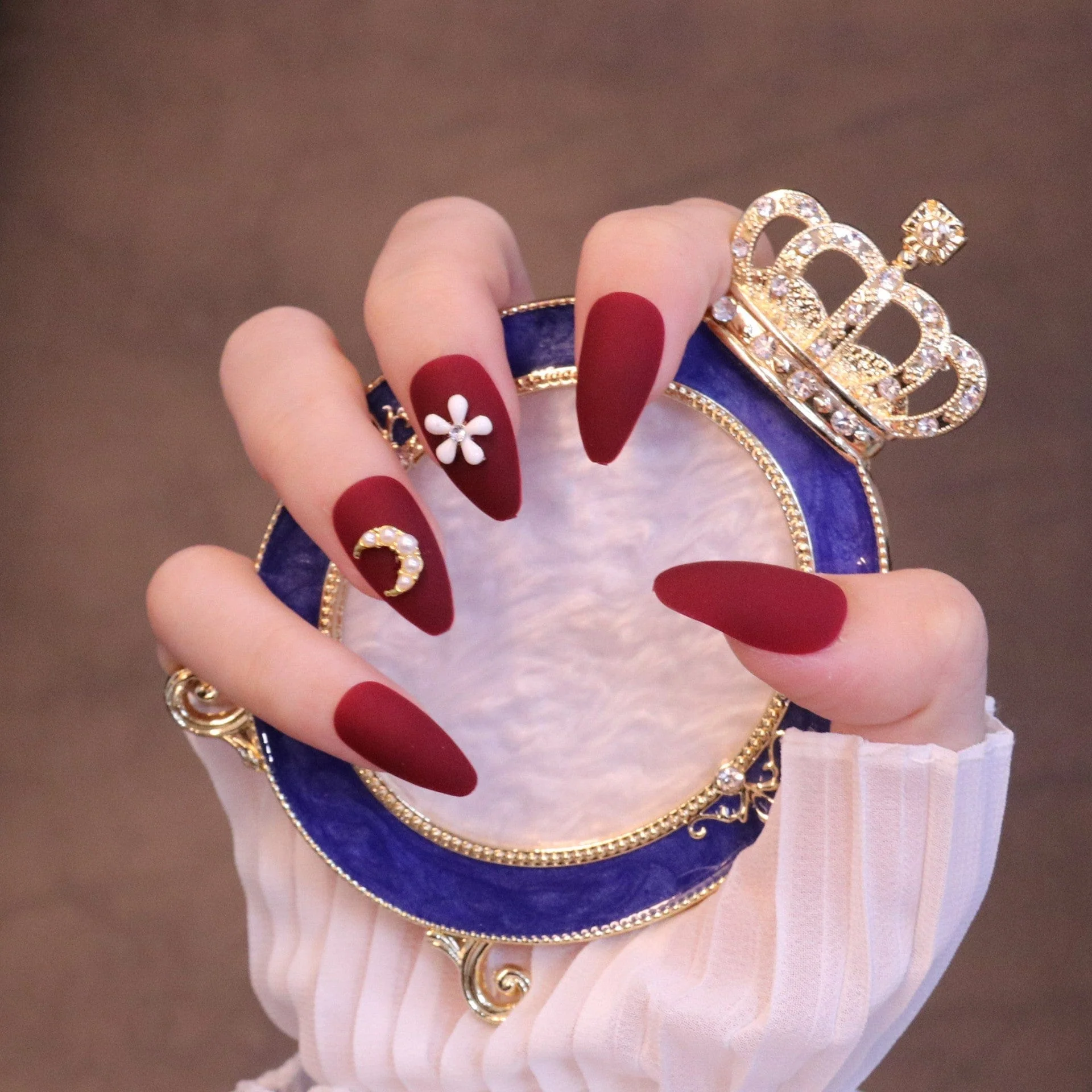 Medium Almond Matte Red Press On Nails with Flower and Moon Charms - Image 5