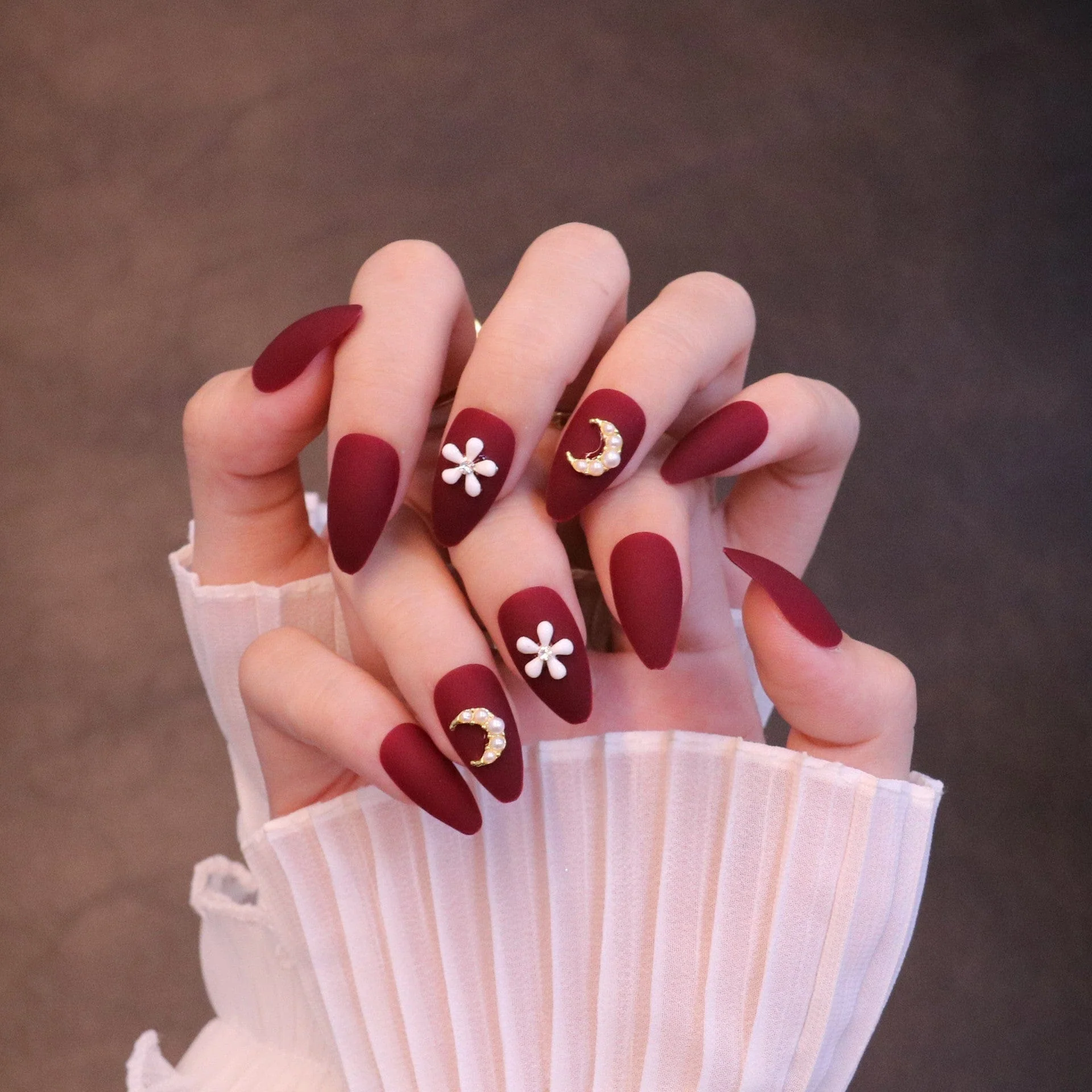 Medium Almond Matte Red Press On Nails with Flower and Moon Charms - Image 6