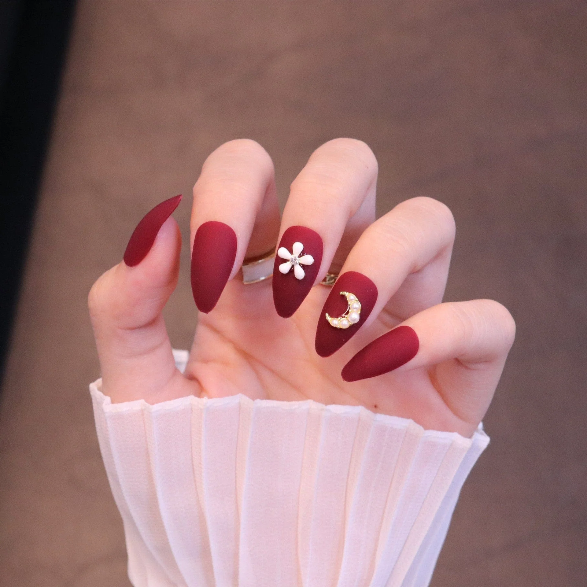 Medium Almond Matte Red Press On Nails with Flower and Moon Charms - Image 7