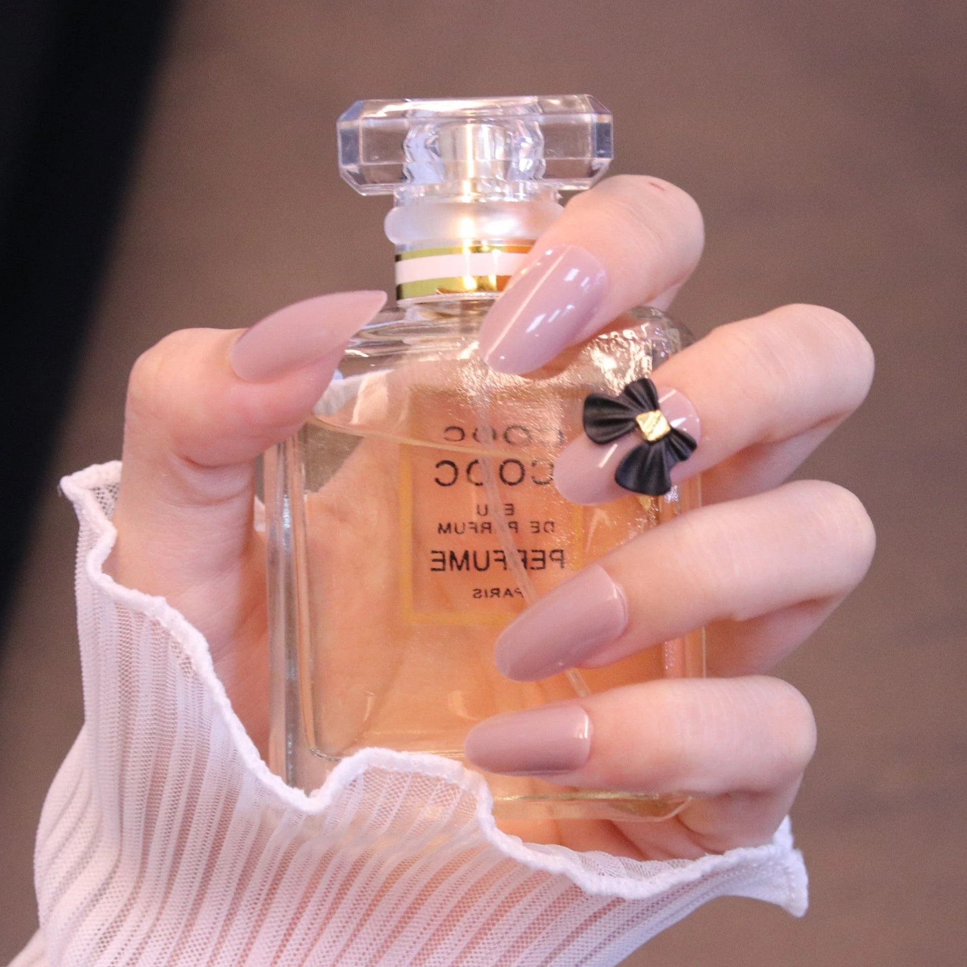 Medium Rounded Nude Press On Nails with Black Bow - Image 3