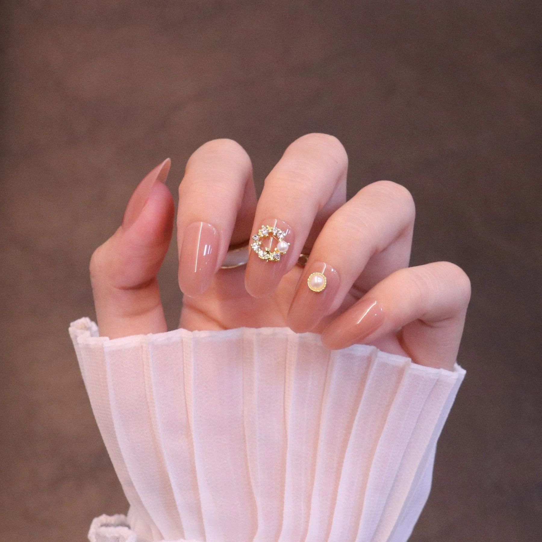 Medium Rounded Nude Press On Nails with Wreath Charm and Pearl - Image 4