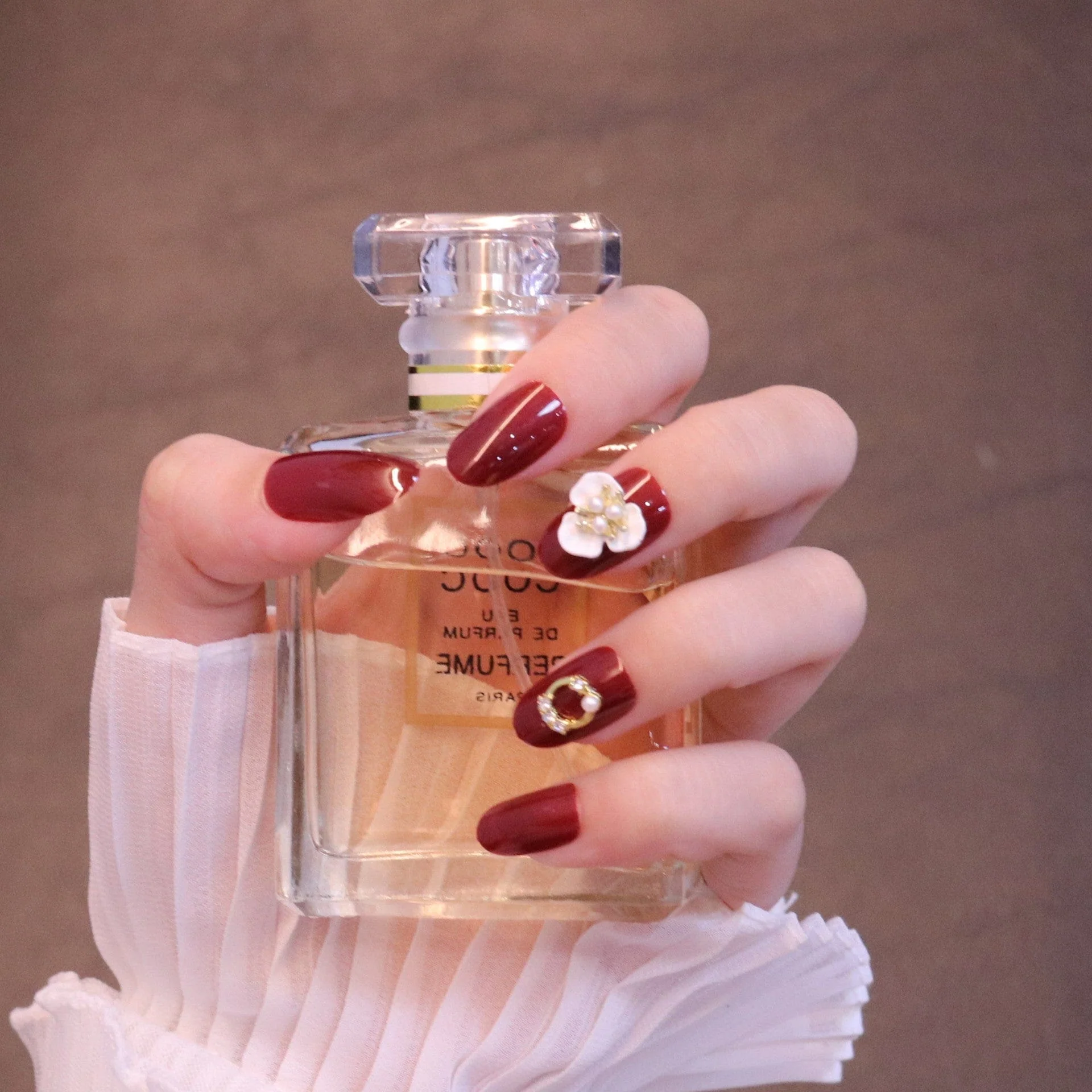 Medium Rounded Red Press On Nails with Flower and Pearl Charms - Image 4