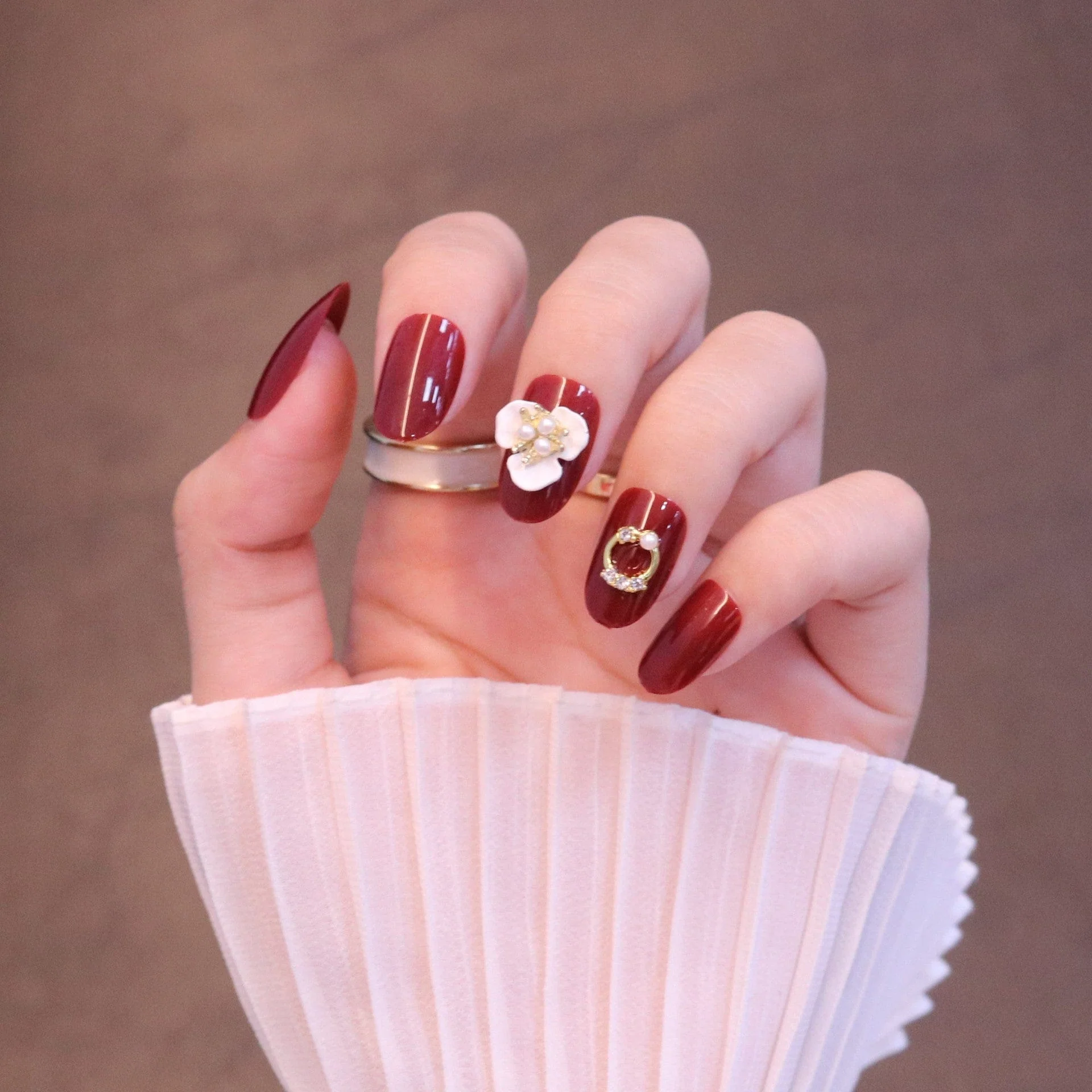 Medium Rounded Red Press On Nails with Flower and Pearl Charms - Image 7