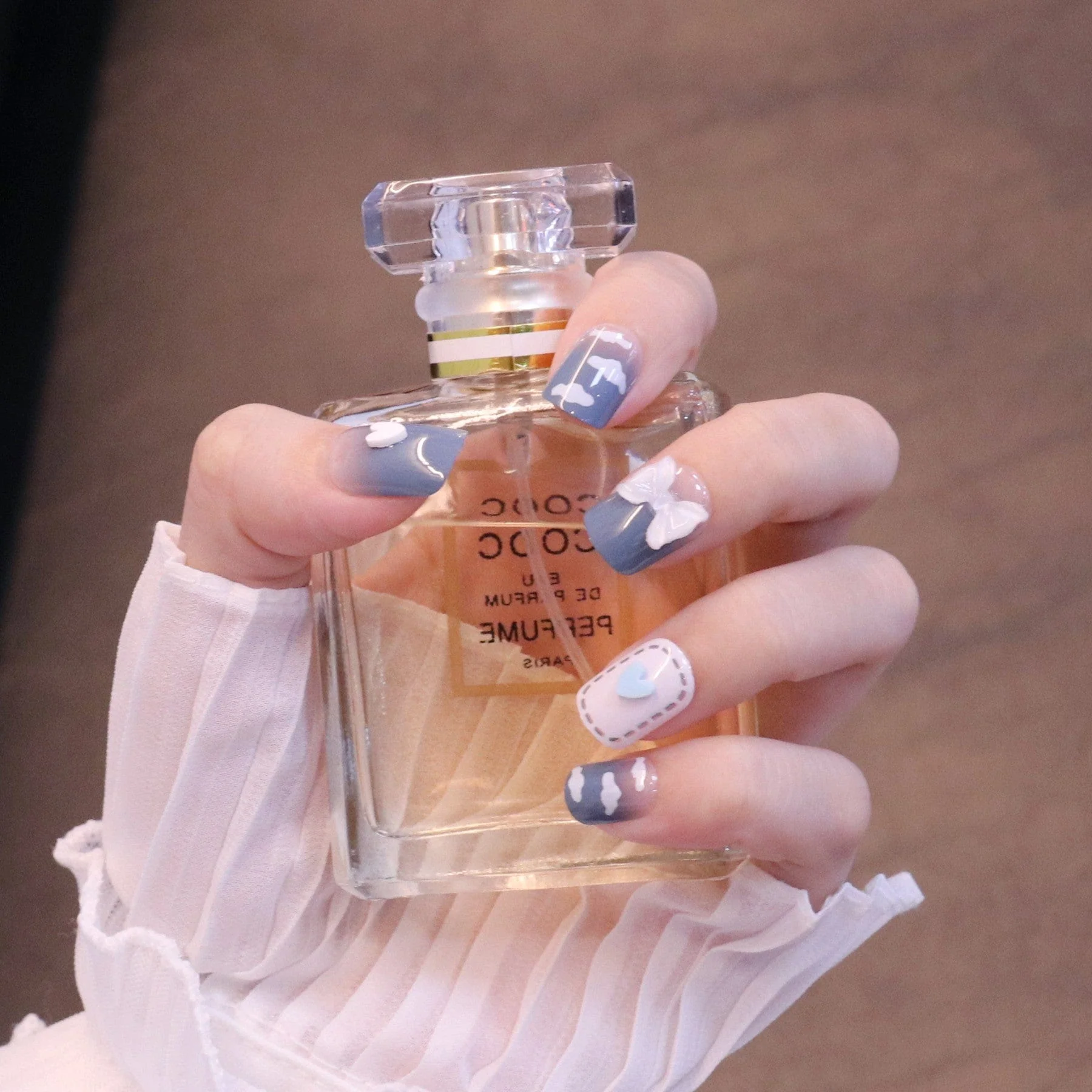 Medium Squared Blue Press On Nails with Bow Charms and Clouds - Image 4